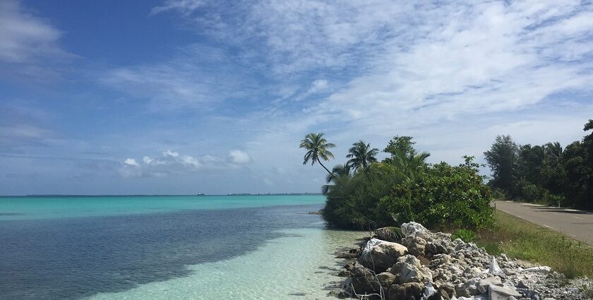 A scenic vista of shimmering blue waters and pristine golden shorelines in Maldives.