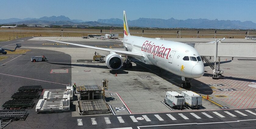 Ethiopian Airlines aircraft parked at Cape Town International Airport with a clear sky