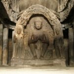 Beautiful panoramic view of ancient god carvings & structures in buddhist caves worldwide.