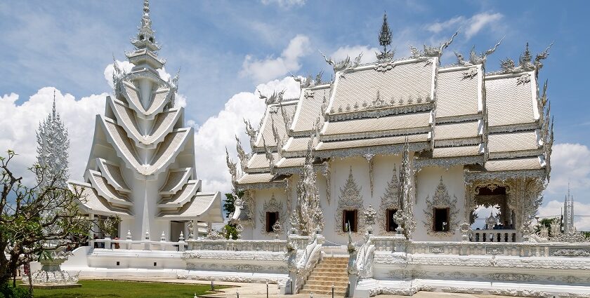 Beautiful view of Chiang Rai, featuring a stunning temple with intricate details and lush greenery.