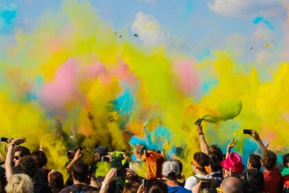 An amazing view of the Holi celebrated with vibrant surroundings, a festival in March.