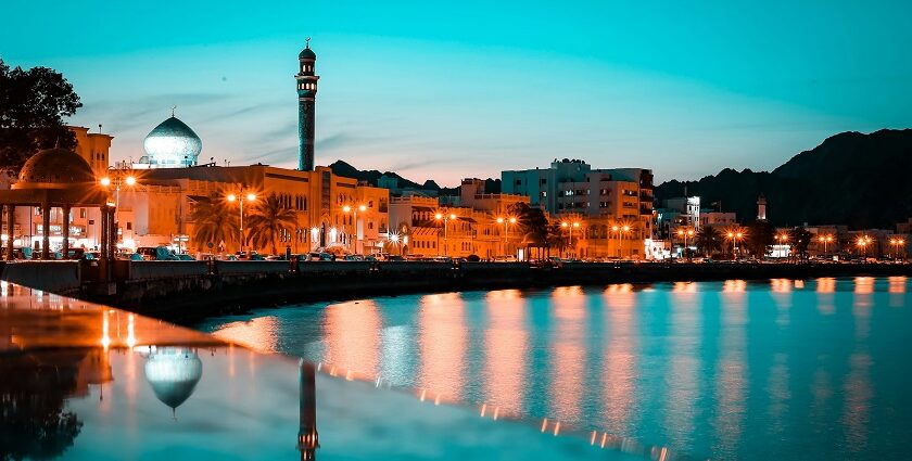 An image skyline during night time, highlighting things to do in Muscat at night