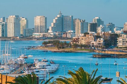 A vibrant coastal cityscape with luxury yachts and high-rise buildings showcases Punta del Este, an iconic place to visit in Uruguay.