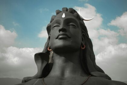 Scenic view of a statue, nearby hill ranges, which are places to visit near Coimbatore.