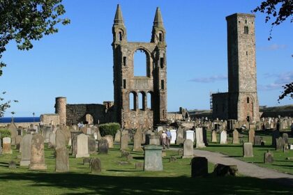 St Andrews Cathedral and St Rule's Tower ruins under blue sky, one of the best places to visit near Edinburgh.