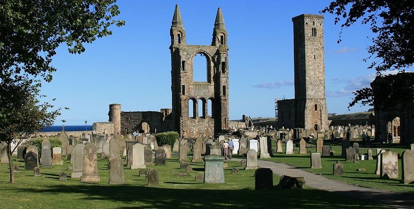 St Andrews Cathedral and St Rule's Tower ruins under blue sky, one of the best places to visit near Edinburgh.