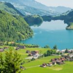 Lake Sarnersee, with mountains, lakeside houses, and clear skies, one of the best places to visit near Lucerne.