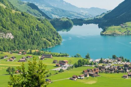 Lake Sarnersee, with mountains, lakeside houses, and clear skies, one of the best places to visit near Lucerne.