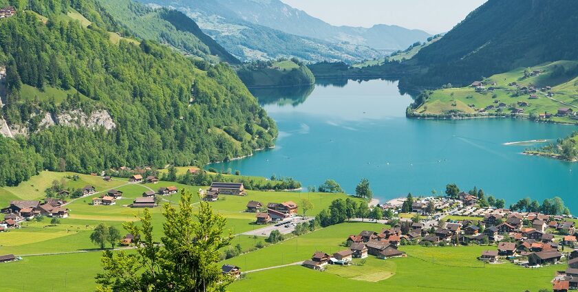 Lake Sarnersee, with mountains, lakeside houses, and clear skies, one of the best places to visit near Lucerne.