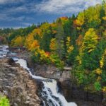 Canyon Sainte-Anne in autumn foliage, a top places to visit near Quebec City.