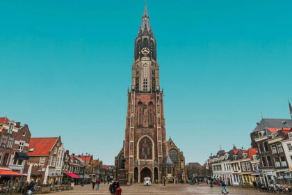Historic Delft church under blue sky, one of the best places to visit near Rotterdam.