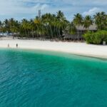 Turquoise beach in the Maldives, a tropical gem among places to visit near Seychelles.