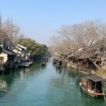 Traditional canal houses and boats in Wuzhen, one of the best places to visit near Shanghai.