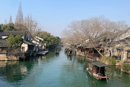 Traditional canal houses and boats in Wuzhen, one of the best places to visit near Shanghai.
