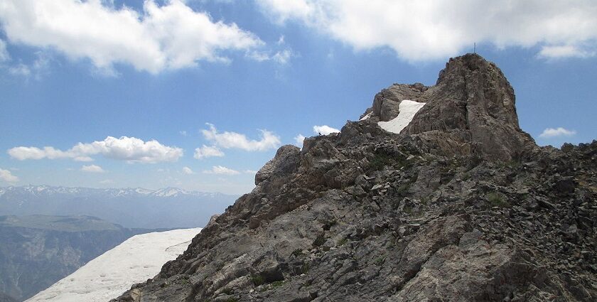 Chimgan Mountain scenic view with green hills, among peaceful places to visit near Tashkent.