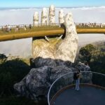The Majestic Golden Bridge in Vietnam showcases breathtaking views and places to visit near Thailand.