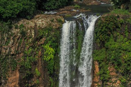 Orinduik Falls cascading over rocks with lush greenery—top things to do in Guyana.