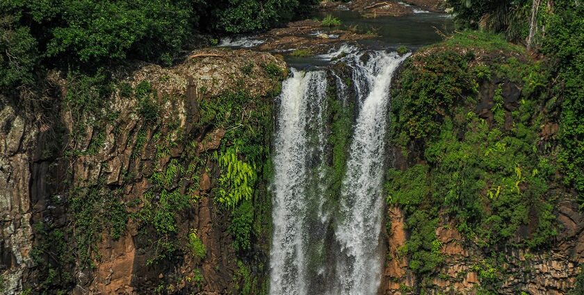 Orinduik Falls cascading over rocks with lush greenery—top things to do in Guyana.