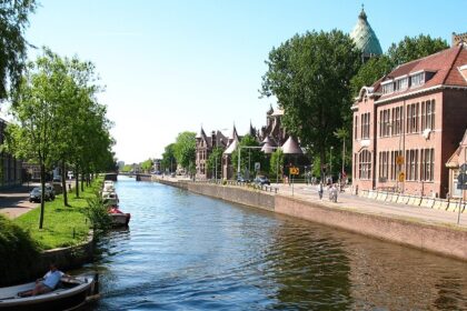 Haarlem canal with city lights and reflections, top things to do in Haarlem at night.