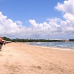 Exploring the serene shore is one of the most romantic things to do in Kuta for couples.