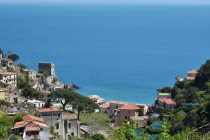 Maiori town with seafront promenade, pastel buildings, and lush hills on the Amalfi Coast, Maiori.