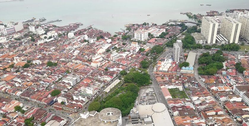 Savour scenic views of Penang island from The TOP, Komtar, one of the best things to do in Malaysia with family.