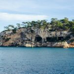 Exploring Cala Mitjana is one of the most serene things to do in Menorca Spain.