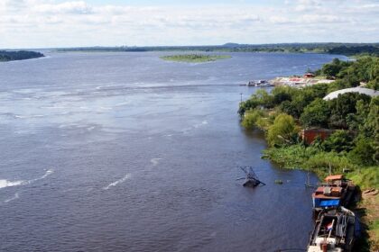Paraguay River cruise with boats and lush greenery, showing things to do in Paraguay.