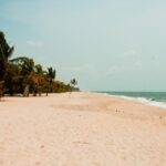 Shankhumugham beach with wide sandy shore and calm waves, one of the places to visit near Attingal.