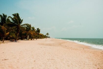 Shankhumugham beach with wide sandy shore and calm waves, one of the places to visit near Attingal.