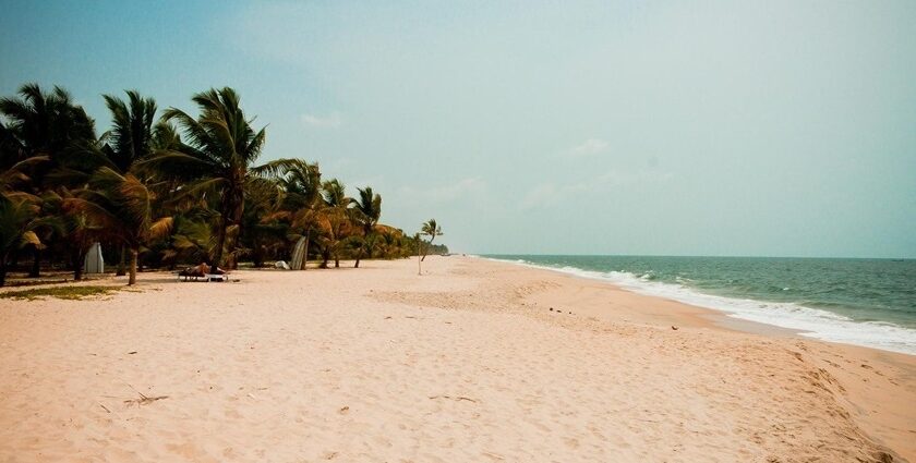 Shankhumugham beach with wide sandy shore and calm waves, one of the places to visit near Attingal.