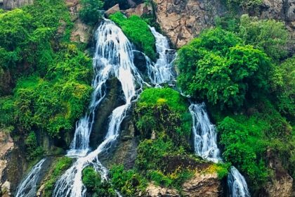 Chunchi Falls surrounded by rocks and greenery, one of the best places to visit near Bangalore for 1 day.