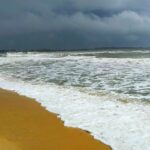 Golden sands and calm Arabian Sea at Malpe Beach, one of the top places to visit near Byndoor.