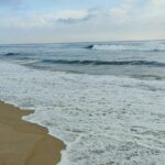 Marina Beach shoreline during monsoon among top places to visit near Chennai in July.