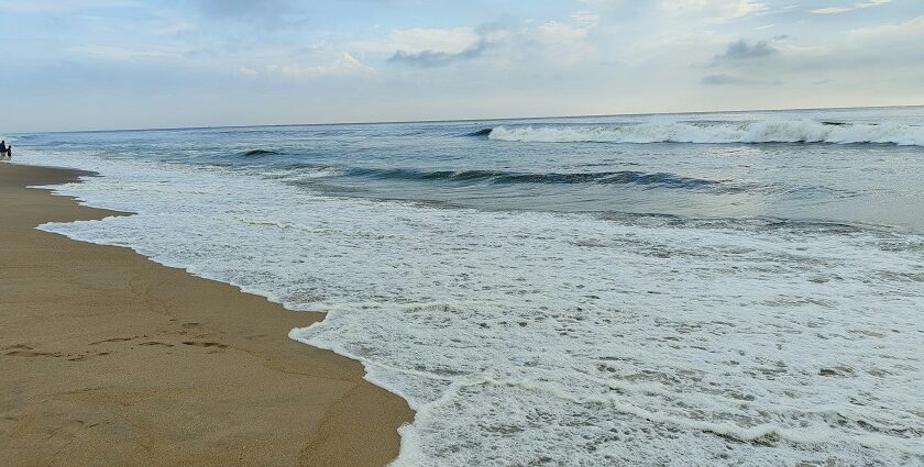 Marina Beach shoreline during monsoon among top places to visit near Chennai in July.