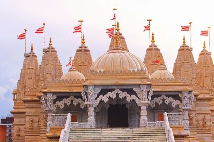 ISKCON Temple exterior with domes and pillars, one of the top places to visit near Grand Venice Mall