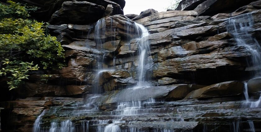 Tincha Falls cascading from cliffs, one of the scenic places to visit near Hanumantiya.