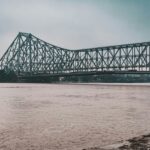 Vidyasagar Setu over Hooghly River at dusk, one of the places to visit near Howrah Station.