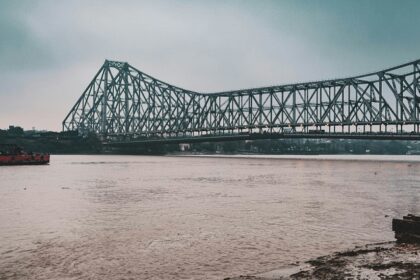 Vidyasagar Setu over Hooghly River at dusk, one of the places to visit near Howrah Station.