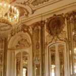 Elegant arched hall and chandeliers inside Elysee Palace, one of the top places to visit near Kapurthala.
