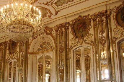 Elegant arched hall and chandeliers inside Elysee Palace, one of the top places to visit near Kapurthala.