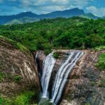 Vaideki Falls in a lush forest, a hidden gem among places to visit near Kodiveri.