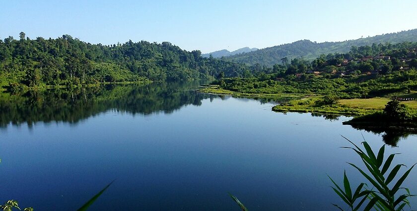 A scenic view of the Shilloi Lake surrounded by lush greenery, one of the stunning places to visit near Kohima.
