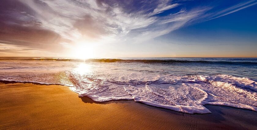 Mandarmani beach sunset on sandy shore, one of the serene places to visit near Kolkata for 2 days.