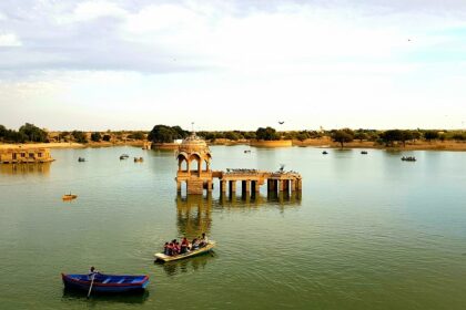 Gadisar Lake in Jaisalmer with sunset view, showcasing what is the best time to visit Jaisalmer.