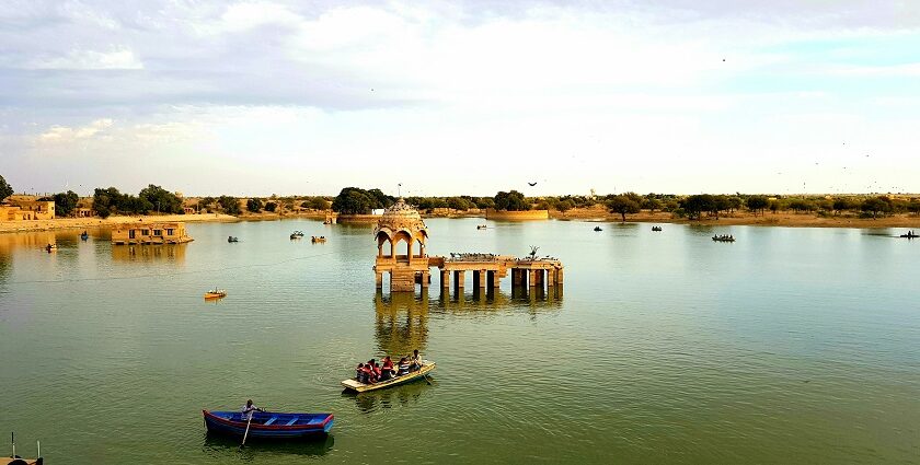 Gadisar Lake in Jaisalmer with sunset view, showcasing what is the best time to visit Jaisalmer.