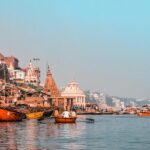 Varanasi boats docked near the city show what is Varanasi famous for in culture and ghats.