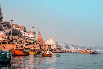 Varanasi boats docked near the city show what is Varanasi famous for in culture and ghats.