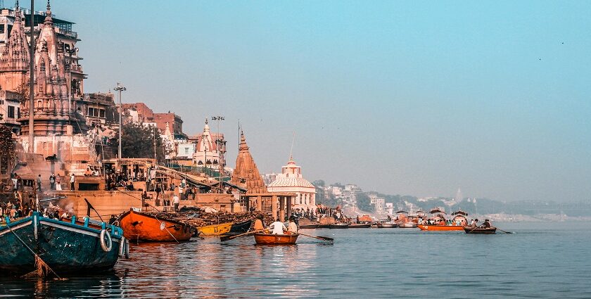 Varanasi boats docked near the city show what is Varanasi famous for in culture and ghats.