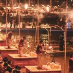 Ganga Aarti at Varanasi ghat during Dev Deepawali in Varanasi with glowing diyas and crowd.